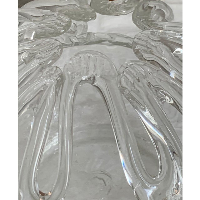 A striking late 19th-century hand-blown clear glass bride’s bank, also known as a crown vase or flower frog, distinguished...