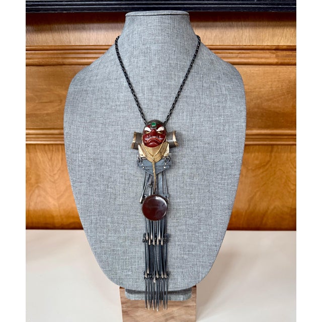 A Japanese Hanataka Tengu Necklace by American artisan jeweler Mary Ann Scherr (1921-2016). The highly unusual pendant...