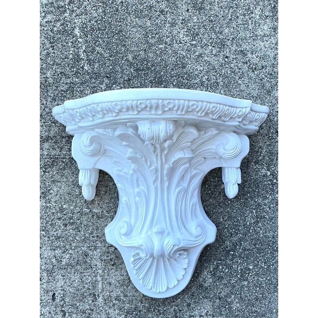This ornate architectural wall bracket is a masterful expression of Neoclassical design, bringing a sense of historic...