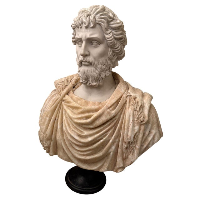 A striking 20th-century bust of the Roman Emperor Septimius Severus, masterfully carved in richly figured marble and...