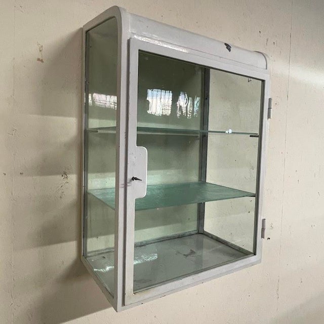 Authentic doctor's/pharmacy cabinet dating back to the mid-1900s (the height of the modernist/industrial era). A timeless...