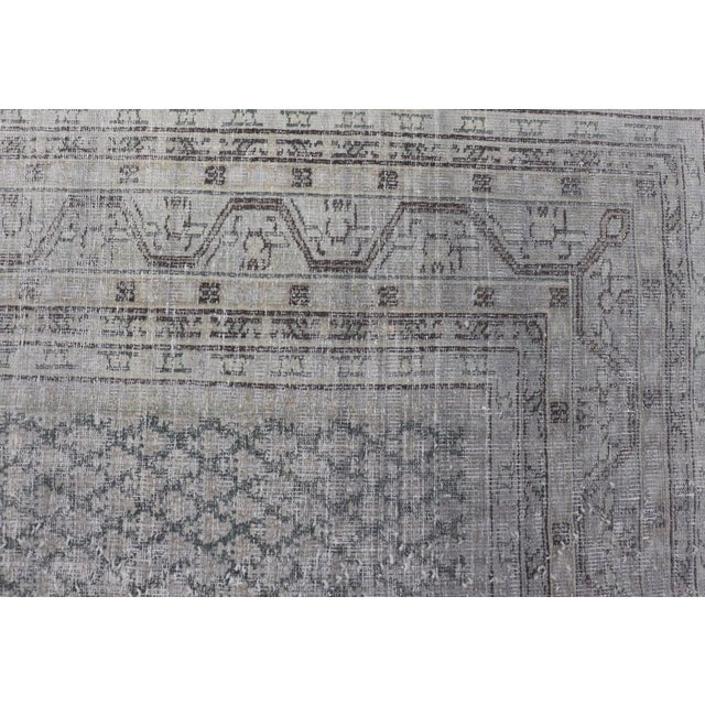 Distressed Persian Antique Tabriz Carpet With Muted Floral Design in Light Gray For Sale - Image 9 of 11