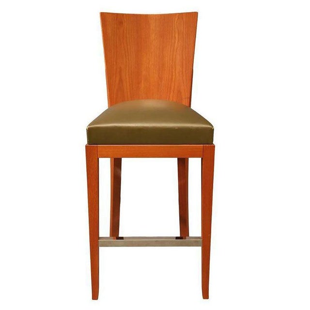 Dakota Jackson designed the barstool part of the "Cadette" Collection inspired by a cadet’s uniform. The stool features a...