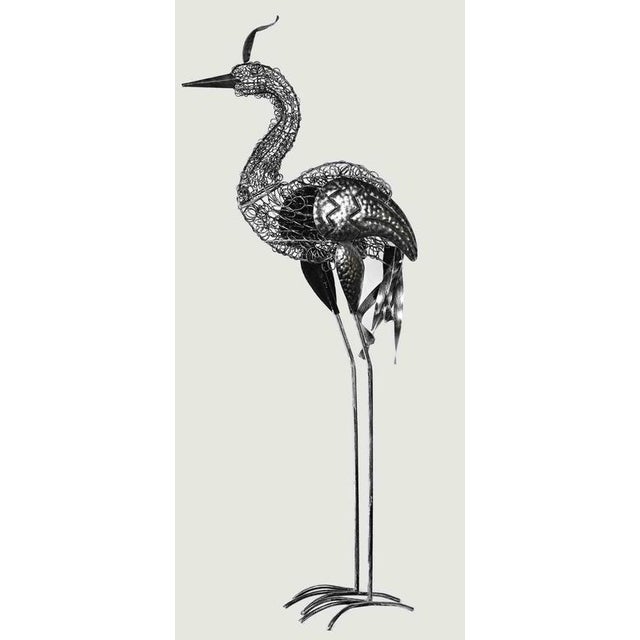 Heron is an orginal contemporary sculpture realized by the artist Bob Paulson in 2020. Hand-beaten metal sculpture...
