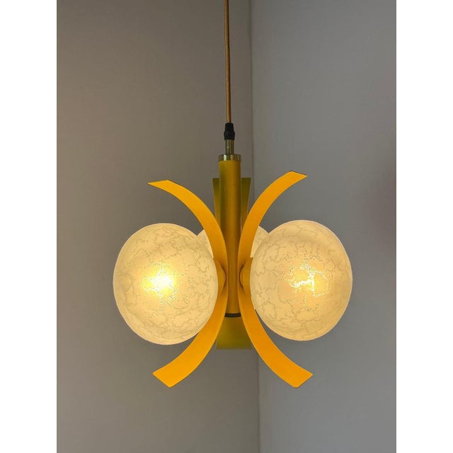 This pendant lamp by richard essig is a bold statement of the space age and a shining example of the colorful design...