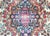 A stunning early 20th century Persian Kirman rug with a central floral medallion with a stepped floral pattern with myriad...