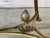 Neoclassical Brass and Black Stone Gueridon Side Table. Table is designed in the French Louis XVI Neoclassical manner. It...