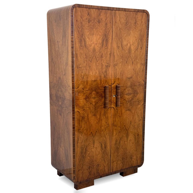 A two-door Art Deco wardrobe dating from the 1930s, characterised by its softly rounded corners, balanced proportions and...