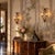 Pair of Italian sconces dating back to the early 20th century, crafted in burnished metal and glass. Each sconce features...