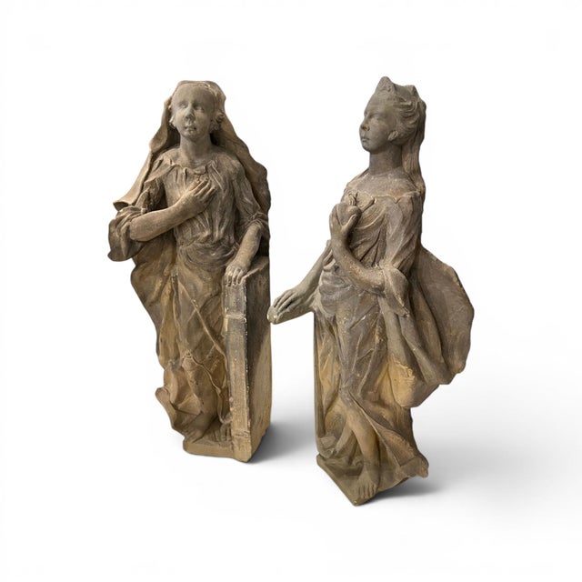This impressive pair of 18th century German stone statues depicts elegantly rendered female figures, showcasing the...
