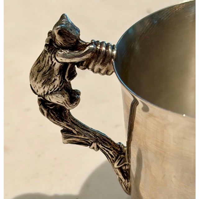 Adorable silver-plate child's cup with Pooh Bear climbing the side for his honey on the handle. Reed and Barton silver-...