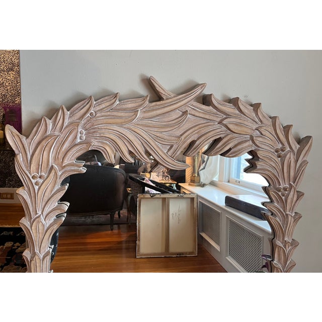 Vintage Serge Roche style carved frond mirror featuring an elegant, nature-inspired frame with intricate detailing. This...