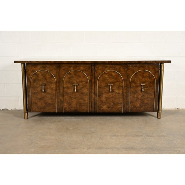 A gorgeous Mid-Century Modern Hollywood Regency sideboard, credenza, or bar cabinet By William Doezema for Mastercraft...