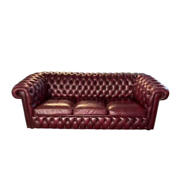 Genuine leather with deep button tufting Traditional Chesterfield with rolled arms and studded detailing Beautiful vintage...