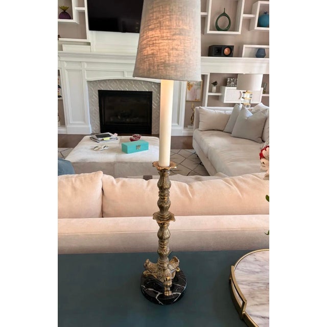 Pair of vintage Frederick Cooper candlestick table lamps crafted in solid cast brass with richly detailed classical...