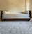 An artist-made craftsman style day bed / chaise longue with bouclé cushions, 21st century. This piece was designed by...