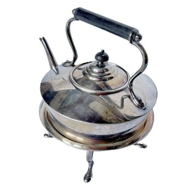 Vintage English silver-plated lidded tea kettle with stand and candle warmer. Wood and silver-plated handle and wood lid...
