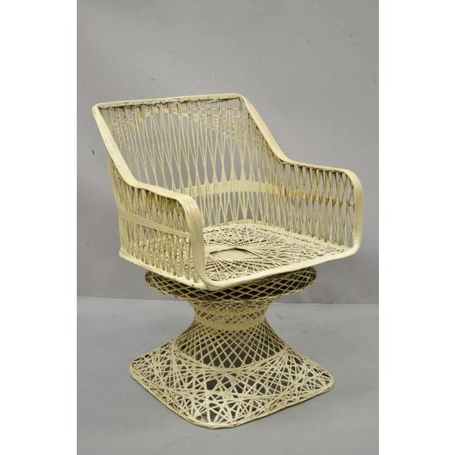 Vintage Russell Woodard Style Woven Spun Fiberglass Armchair. Item features a swivel seat, pedestal base, woven fiberglass...