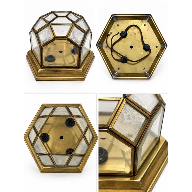 An elegant vintage hexagonal ceiling lantern crafted from warm brass and beveled glass. Its timeless design making it a...