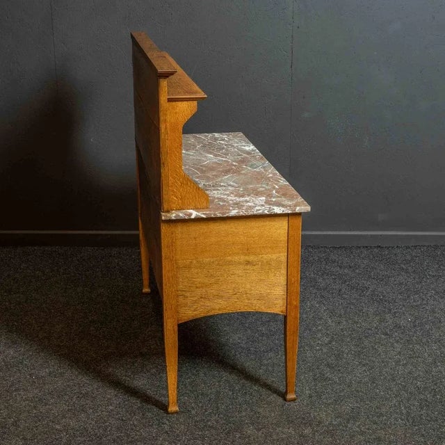 A super quality Arts and Crafts late Victorian washstand with a beautiful tiled back panel. The graining on the 'pink'...