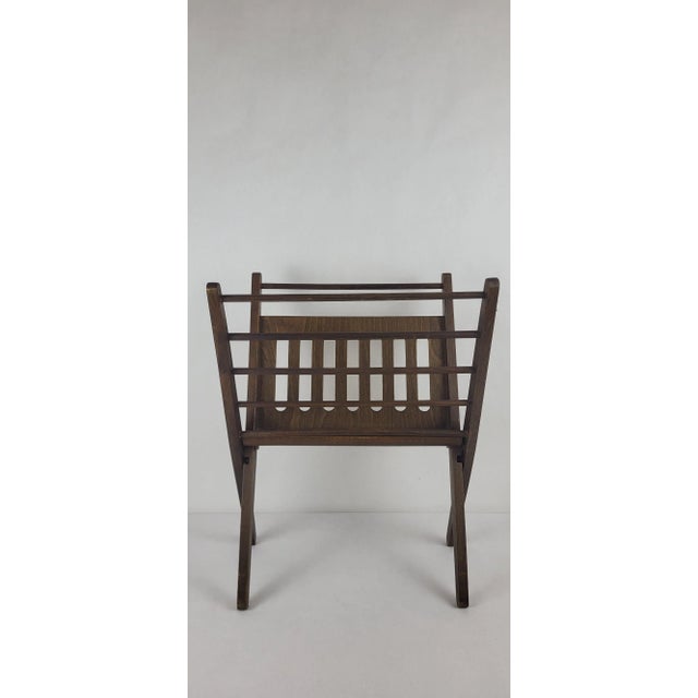 Braakman Magazine Rack, Cees, 1960s / Wood Height 50 cm Width 38 cm Depth 26 cm In good condition. This piece is...