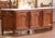 Crafted in Lyon, France circa 1860, this stately Régence enfilade is built from solid walnut and crowned with an...