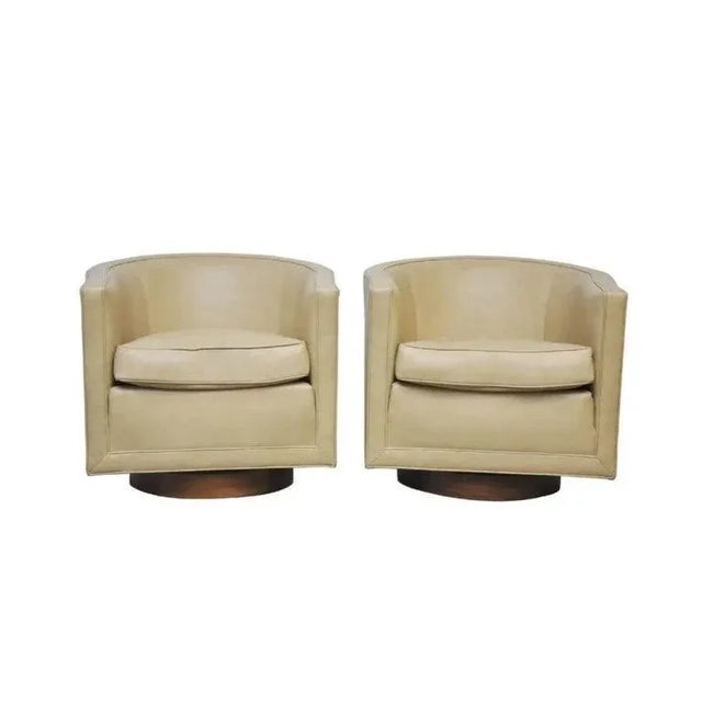 Add some playful elegance to your space with these swiveling Dunbar chairs designed by Edward Wormley, circa 1960's. His...