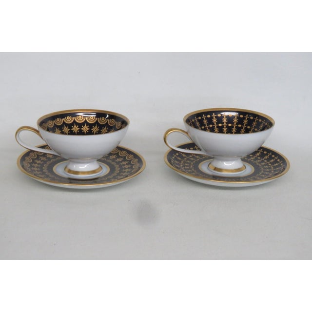 This gorgeous Cups and Saucers Set is made of porcelain. All pieces are stamped on the bottom as having been made by the...
