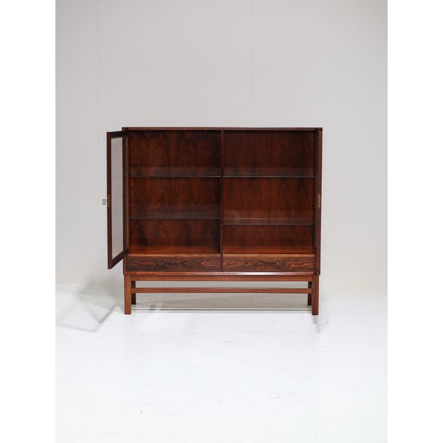 A rare, large display cabinet manufactured by brouer møbelfabrik in denmark during the 1960s. This mid-century piece is...