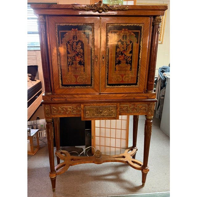 A superb late 18th century French flamed mahogany and Vernis Martin secretaire cabinet in the manner of Paul Sormani...