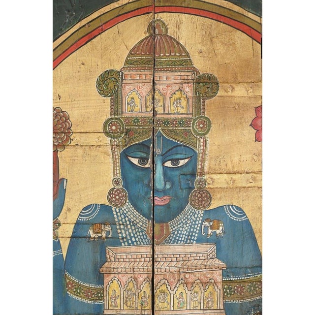 This Vintage Indian Painted Panel is a captivating work of devotional folk art depicting Lord Krishna as Shrinathji, which...