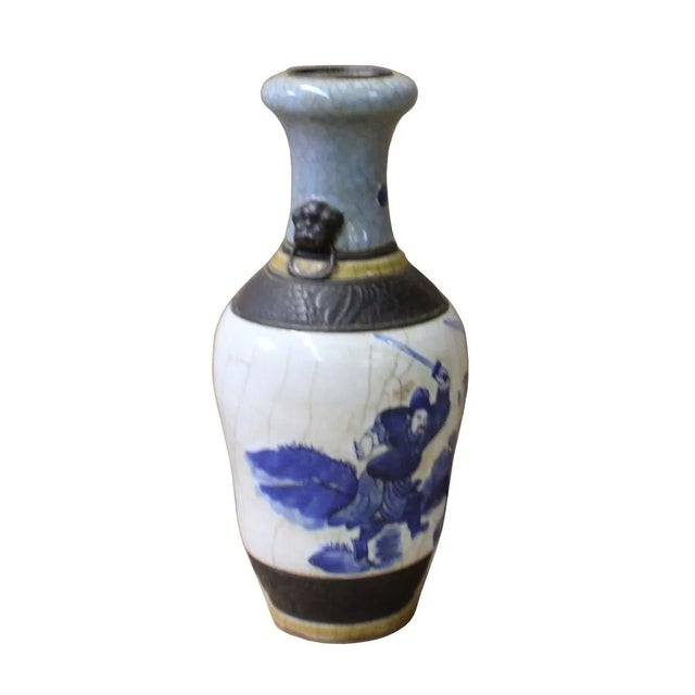 This is a Chinese decorative porcelain vase made of different combination of technique. There are crackle pattern, relief...