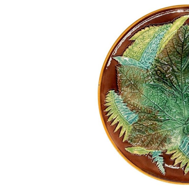 George Jones Majolica Maple Leaf and Ferns Plate, English, ca. 1870, the relief molded dish with a central green-glazed...