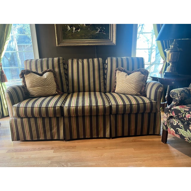 Offered is a Wesley Hall upholstered sofa, traditional, three cushion back with scroll arms over loose seat cushions and a...