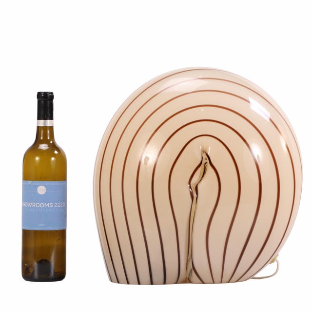 A sculptural “Munega” table lamp by Vistosi, dating to circa 1960. Executed in hand-blown Murano glass, the design...