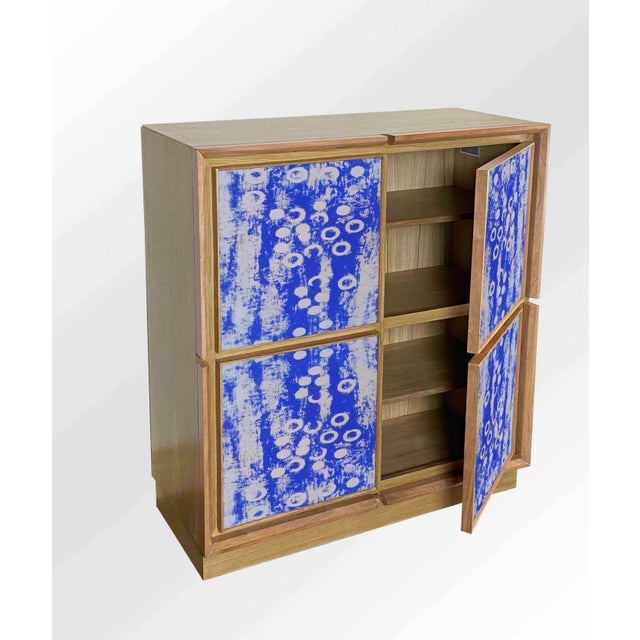 "Disegno Quindici" sideboard, 2026, by Meccani Studio for Meccani Design. A beautiful oak sideboard with cherry and walnut...