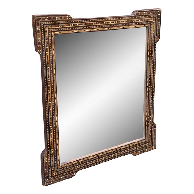 An exquisite mid 20th century Syrian mirror showcasing traditional mosaic inlay craftsmanship. The wooden frame is...