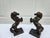 A pair of vintage bronze horse bookends or sculptures, just under 10” inches in height, and in good condition with a...