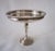 Elegant Sterling Silver compote dish. Slender pedestal with fine ridged border. It measures 7.25"H x 6.5"D and is in...