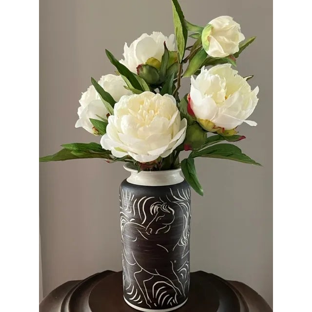 This charming vase depicting two horses is a wonderful example of the work of William C. Alexander (1935-1988). The...