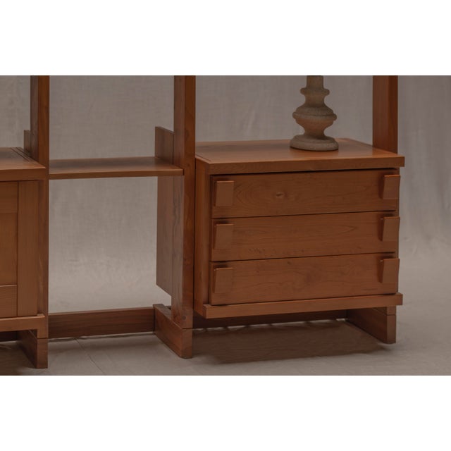 Elegant French wall unit / bookshelf from the 1970s, most likely produced by Maison Regain. Crafted from solid elm wood,...