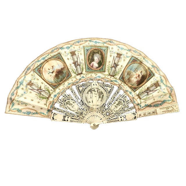 This exquisite piece is a classic Late 18th-Century European folding fan, meticulously crafted during the Louis XVI period...