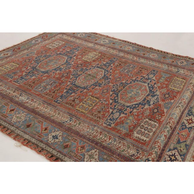 This 8x9 vintage Soumak Dragon rug, hand-knotted in wool circa 1950–1959, showcases three geometric medallions framed by...