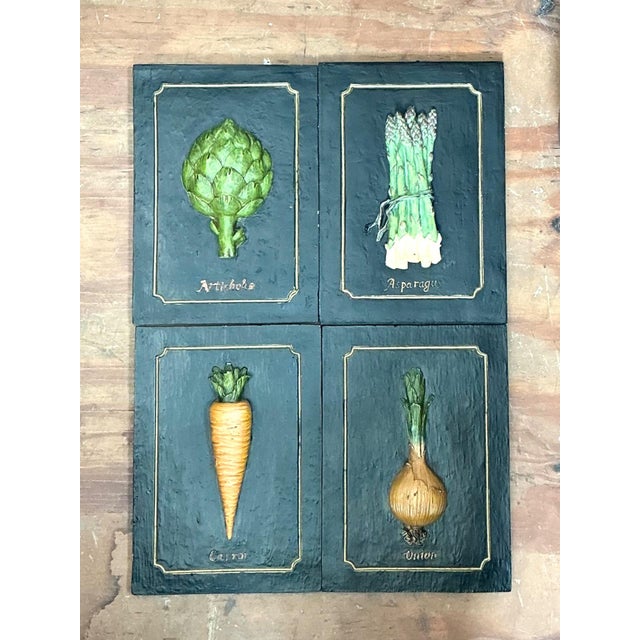 This charming set of four vintage vegetable relief wall plaques celebrates the beauty of everyday forms through skilled...