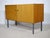 Timeless mid-century design sideboard in wood with metal legs from the 1960s. Two-door cabinet with a clean, minimalist...