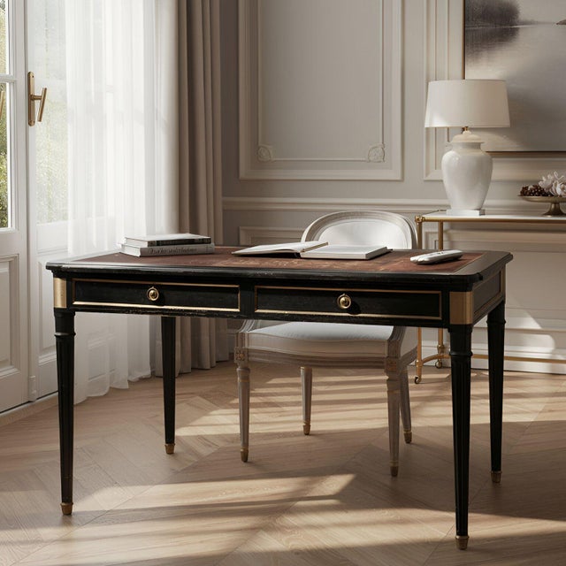 EBONIZED TOOLED-LEATHER BUREAU PLAT IN THE NEOCLASSICAL TASTE France, circa 1940 Attributed to Maurice Hirsch 29 1/2" H x...