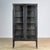 Vintage medicine cabinet from the 1970s, produced in Hungary. The cabinet is made of iron and glass, with the glass held...