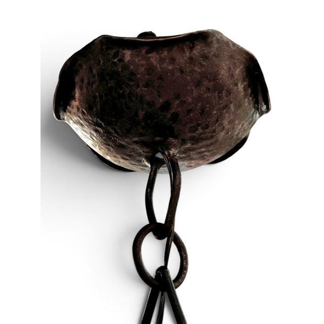 An antique French gothic-style hand-forged wrought iron "corona" (or ring-style) candle chandelier. The heavy scrollwork...
