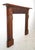 Victorian style mantel made of carved oak on a heart pine base featuring several griffins and perhaps dolphin heads,...