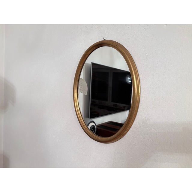 Mirror in a gilded wooden frame from the 1960s. In very good original condition. High-quality craftsmanship from solid...